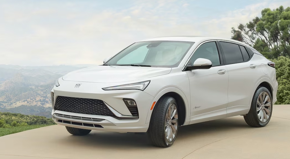 A white 2024 Buick Envista Avenir parked at an overlook.
