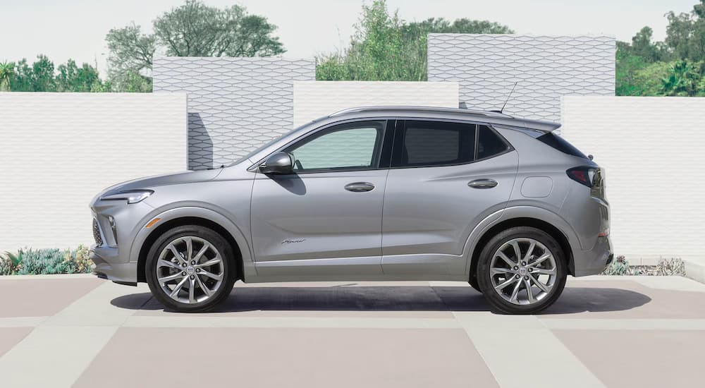 A silver 2025 Buick Encore GX parked by a Buick dealer near Detroit.