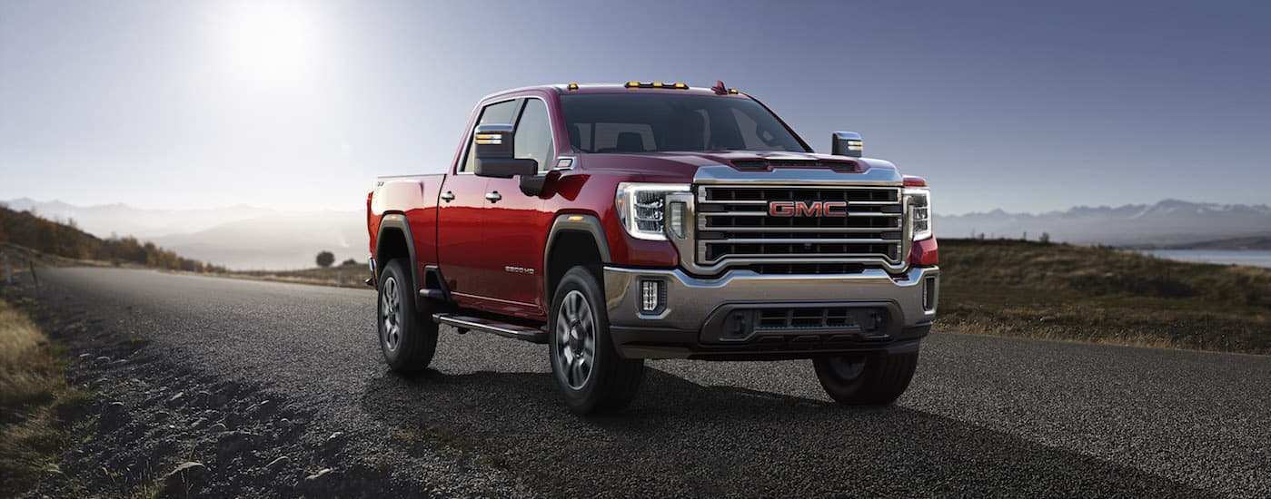 Red 2020 GMC Sierra 2500 HD driving on an open road