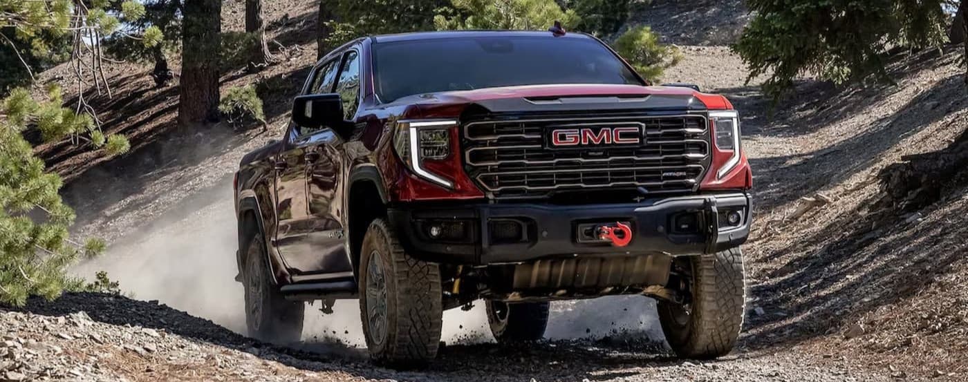 A red 2025 GMC Sierra 1500 AT4X off-roading