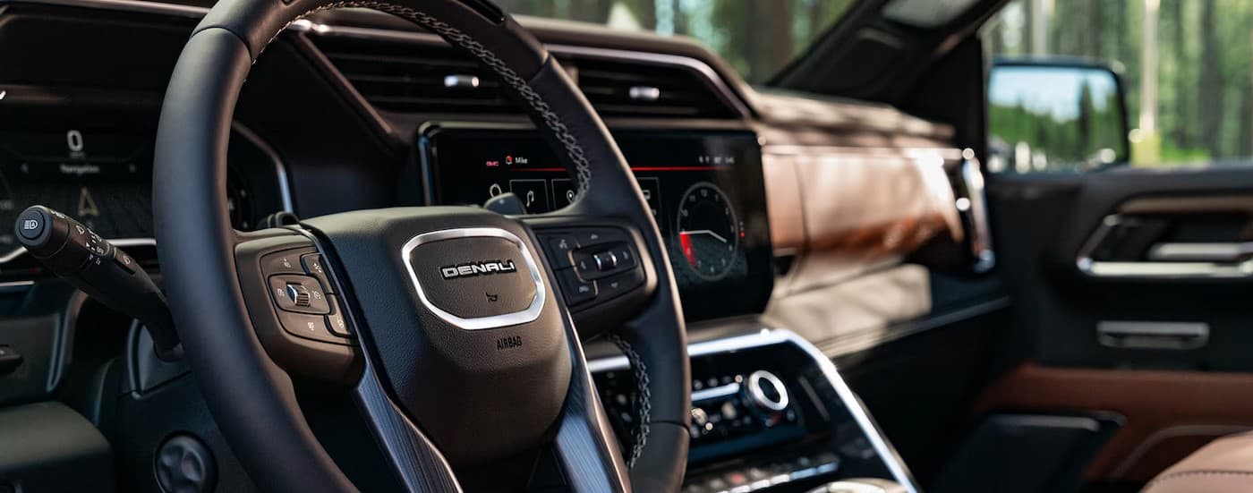 Close-up of the steering wheel in a 2025 GMC Sierra 1500 Denali.
