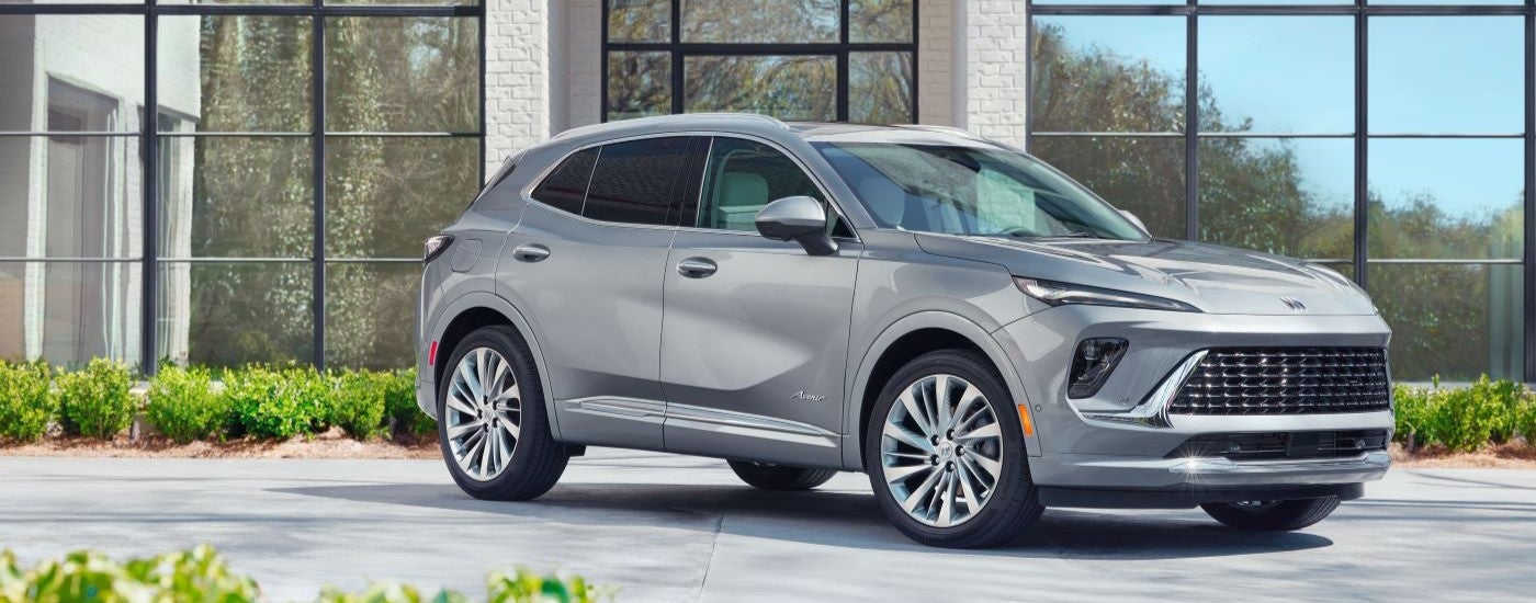 A grey 2024 Buick Envision Avenir parked on a sunny day.