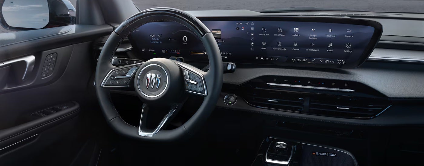 The steering wheel and digital dash in a 2025 Buick Enclave at a Buick dealer near Detroit.