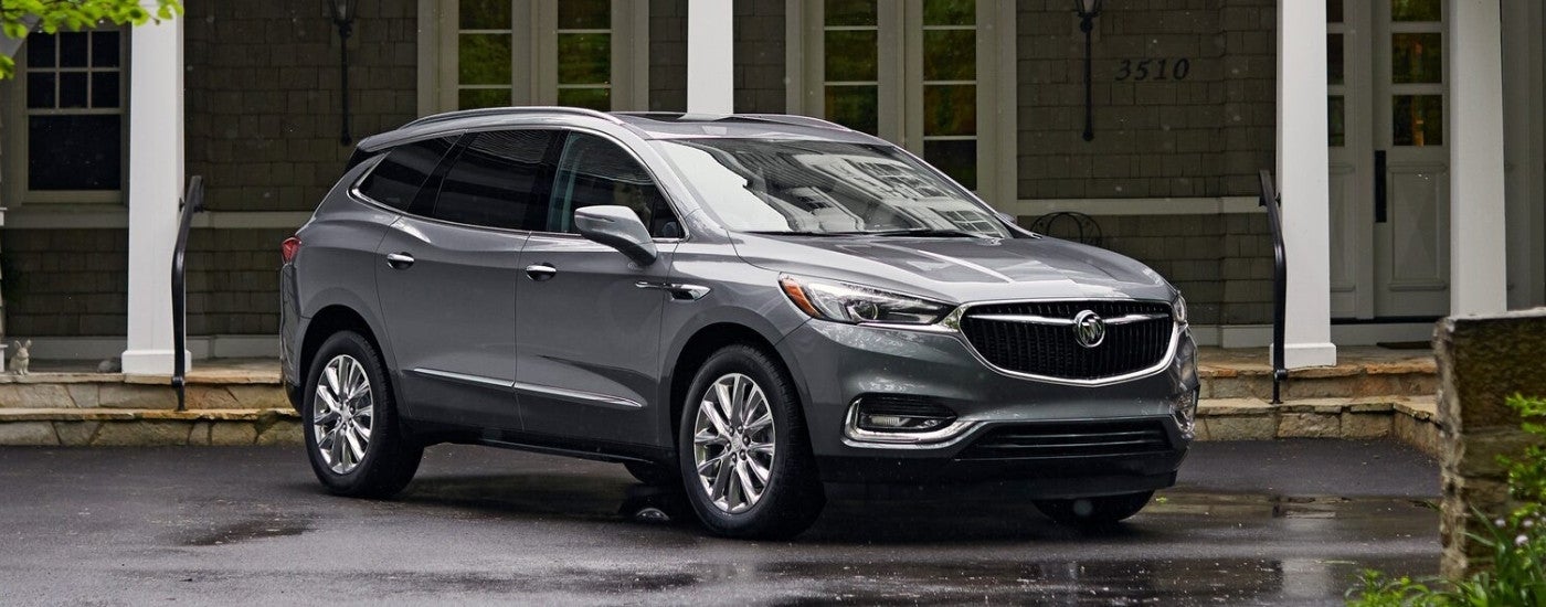 Grey 2019 Buick Enclave parked in front of a building