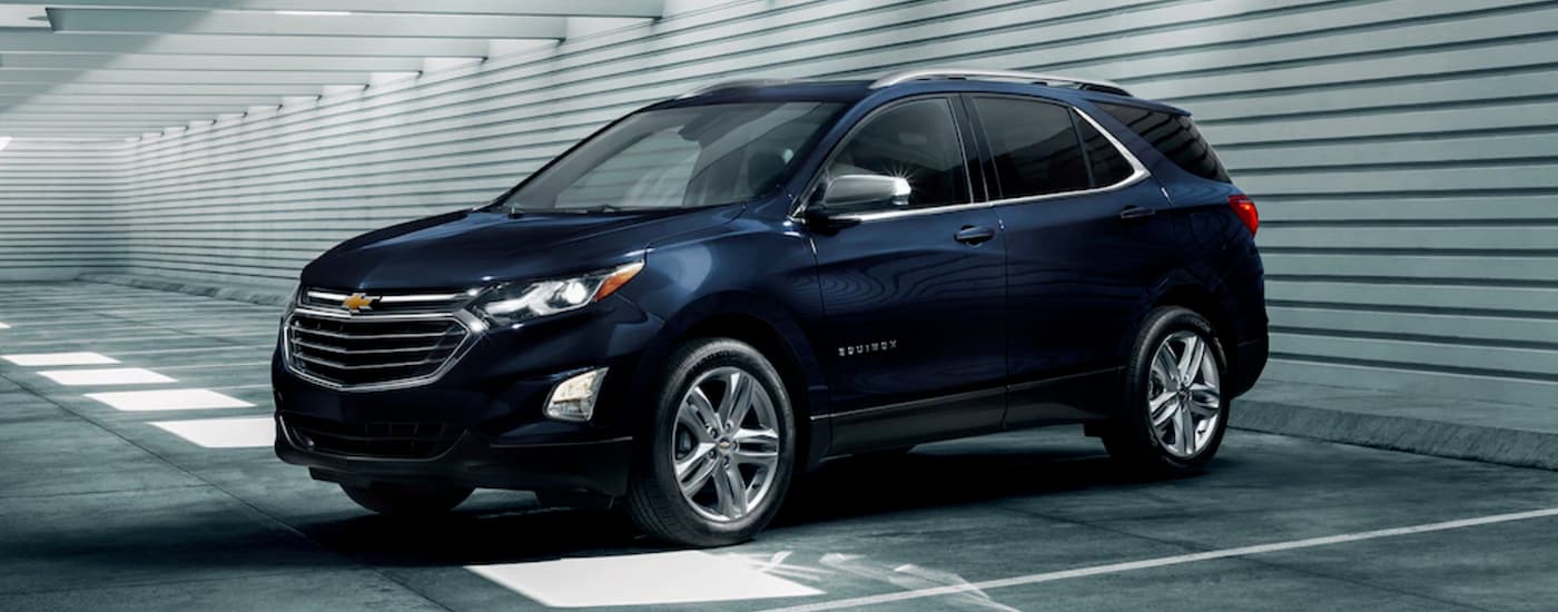 Dark blue 2020 Chevy Equinox parked on a parking lot.