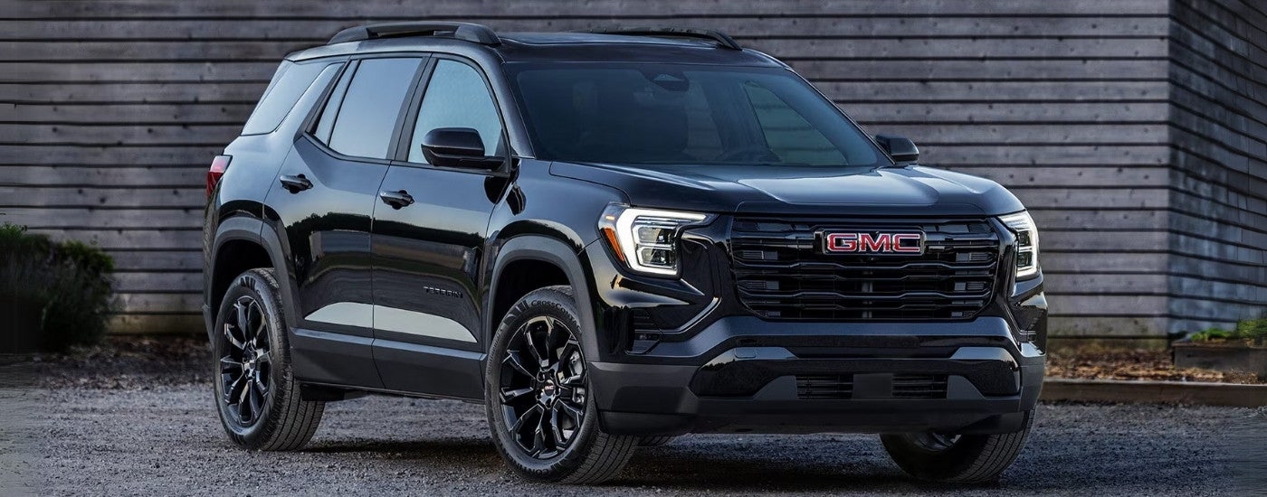 A black 2025 GMC Terrain Elevation parked off-road